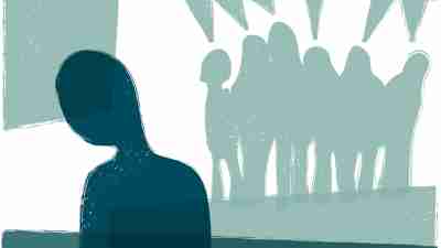 A person being alienated by a group of people.