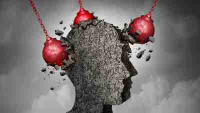Trauma concept image - heavy weights clashing against an individual's head