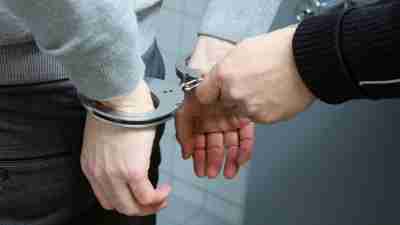 A man being arrested. Undiagnosed ADHD and crime can go hand in hand.